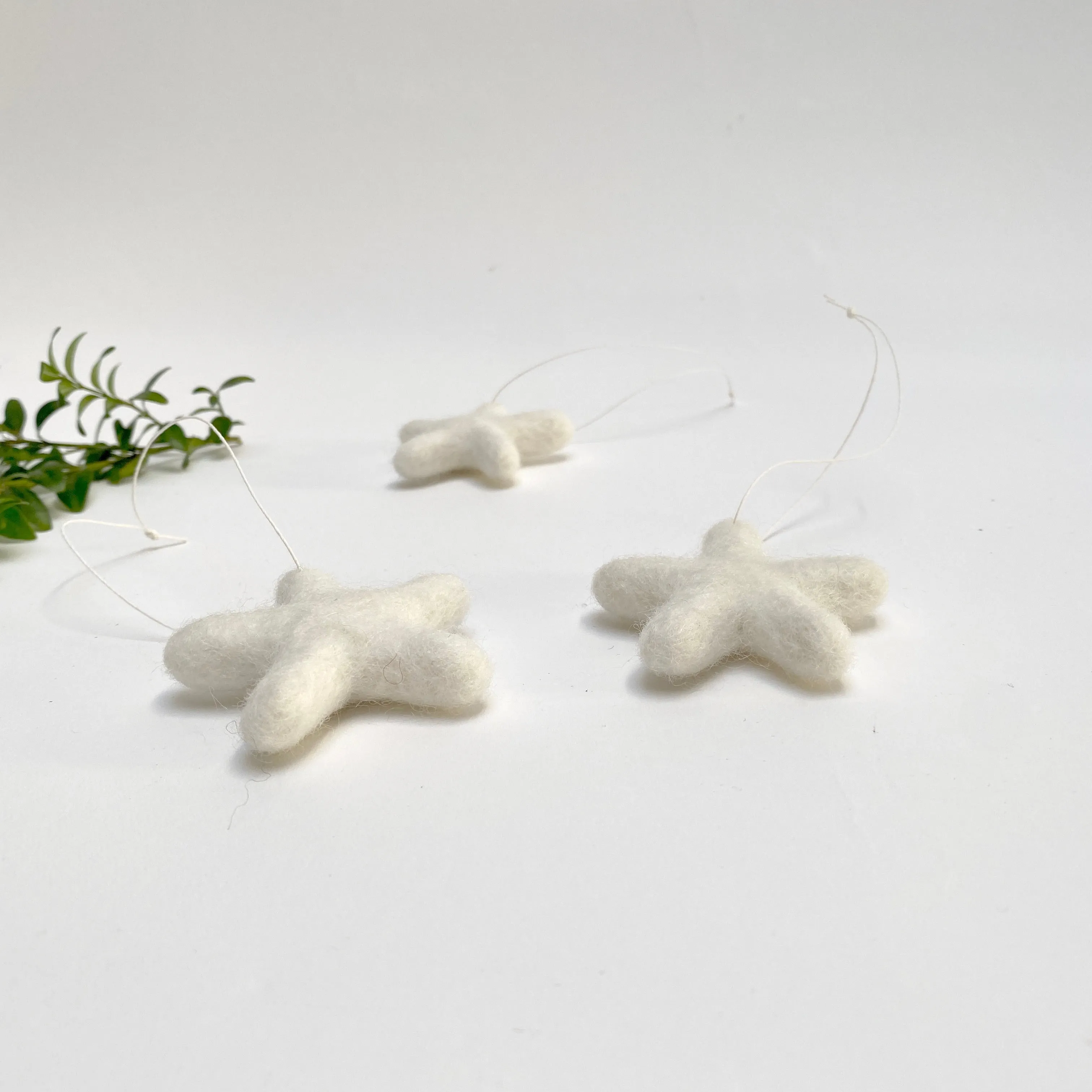set of 3 felted wool stars (in cotton bag)