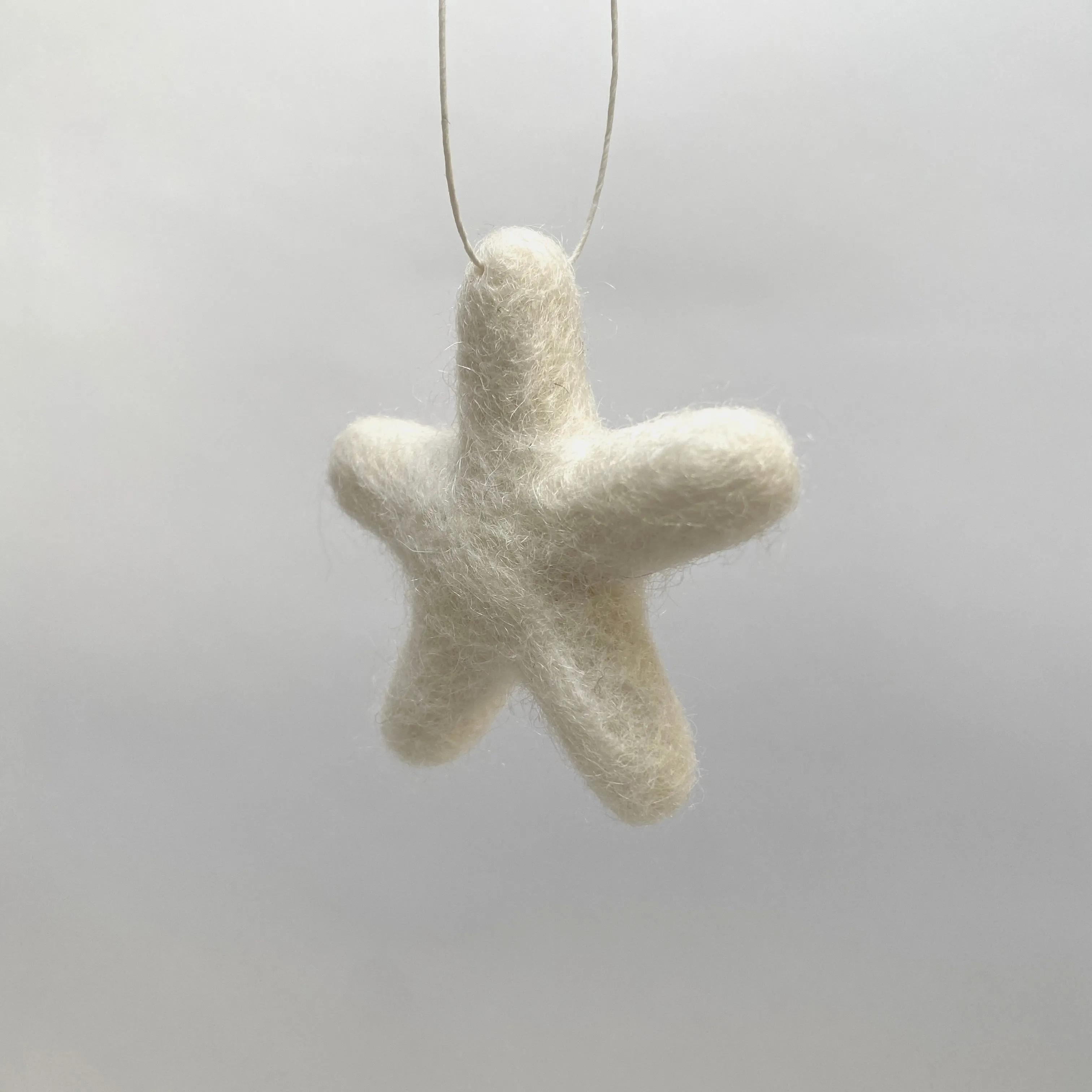 set of 3 felted wool stars (in cotton bag)